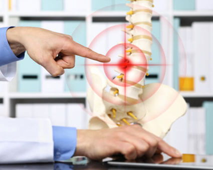 man pointing at spine